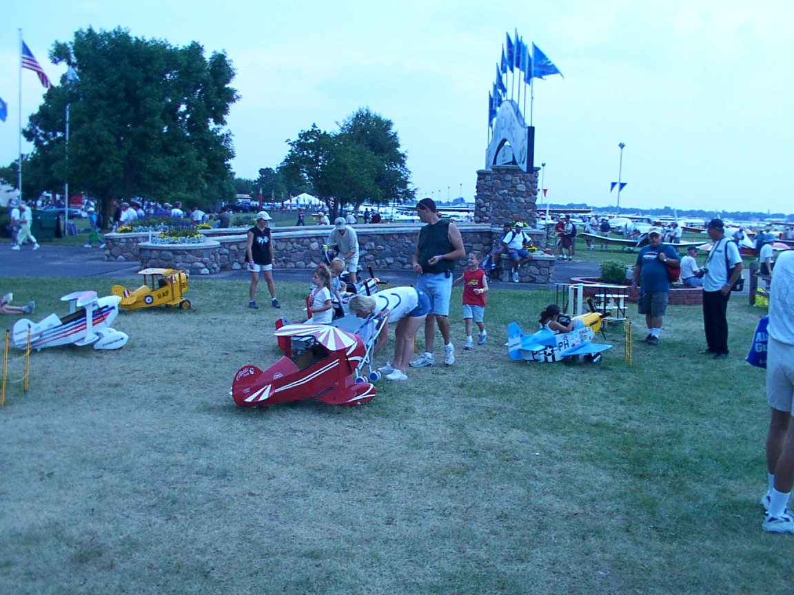 A cute little park for the children to hang out in, with miniature airplanes for them to pretend to fly.  